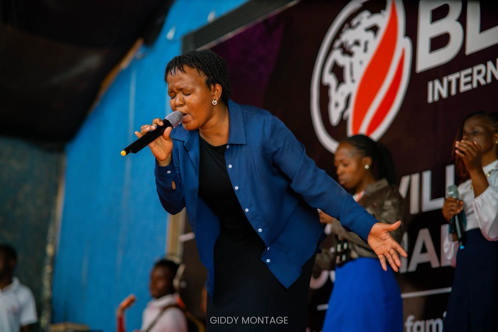 Minister Laura leading the congregation to worship in spirit and truth at Blessed International Fellowship